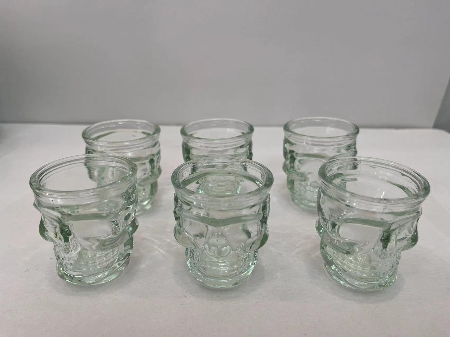 WOQIJENCV 50ml Shot Glasses Set of 6 | Reusable Clear Shot Glass for Vodka Shots, Rum, Brandy, Jello Shots | Heavy Base Shot Glass Set for Home Bar, Pub, Event, Party (Skull shaped)